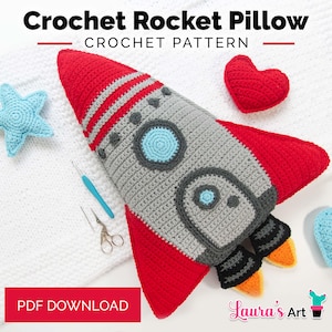 May include: A crocheted rocket pillow in red, gray, and blue, with a matching red heart and blue star. The rocket has a detailed design with stripes and circular accents. The text "Crochet Rocket Pillow" is at the top.