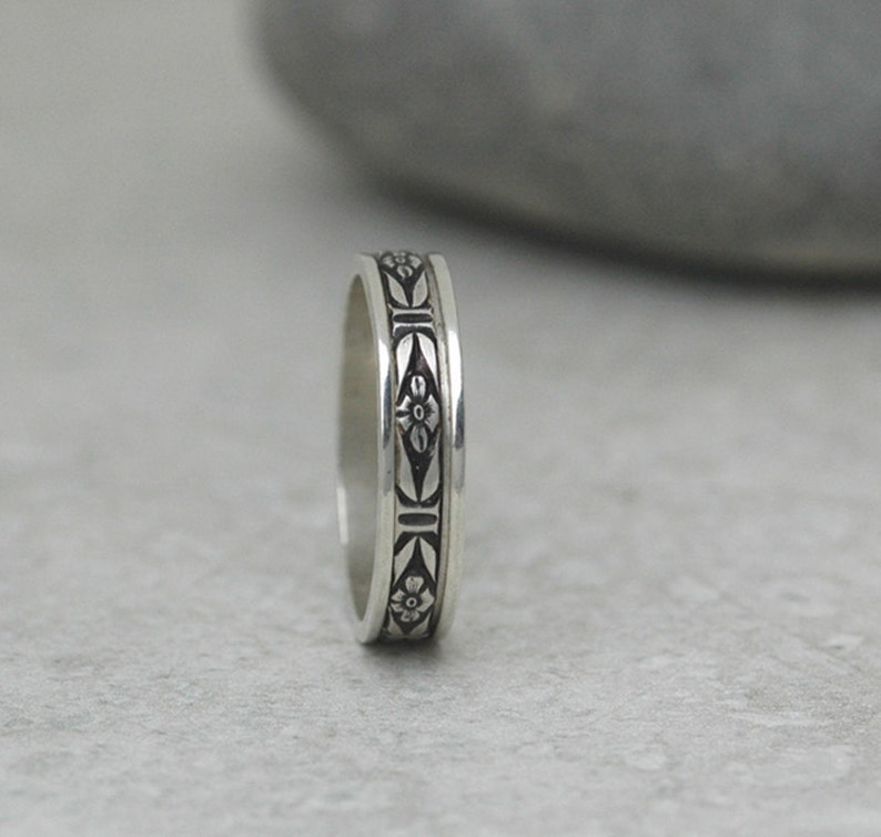 Cherry Blossom Spinner Ring Handmade in Solid Sterling Silver A Delicate Fidget Band 100% made in the USA Nickel Free Meditation Ring shadowed background