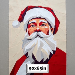 May include: A geometric fabric quilt block featuring a portrait of Santa Claus with a red hat and white beard. The design is composed of angular fabric pieces in shades of red, white, and cream. A rectangular label displays the text 50x65in.