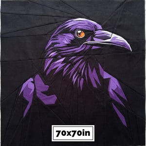 May include: A square fabric quilt block featuring a geometric, pieced design of a raven in shades of black and purple. The bird has a bright orange eye and a sharp beak. A white rectangular label at the bottom displays the text 70x70in.