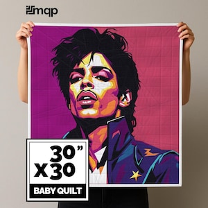 May include: A baby quilt featuring a vibrant pop art style portrait. The quilt measures 30 x 30 inches and showcases a colorful illustration with purple, yellow, and blue hues. The design includes a star on the jacket.