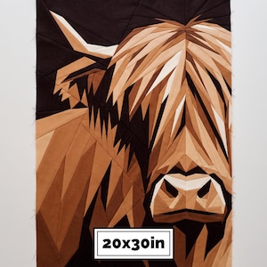 May include: A geometric fabric quilt block featuring a Highland cow portrait in shades of brown, tan, and cream against a dark background. The design is composed of angular, pieced fabric sections. A white label displays the dimensions 20x30in.