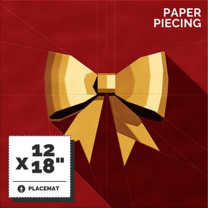 May include: A red background with a gold bow in the center. The text "PAPER PIECING" is at the top of the image. The text "12" x "18" PLACE MAT" is at the bottom of the image.