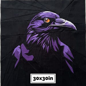 May include: A square fabric quilt block featuring a geometric pieced design of a raven in shades of black and purple with a bright orange eye. The raven is composed of angular fabric segments. A white label at the bottom displays 30x30in.