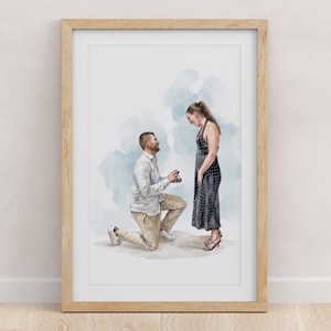 May include: A framed watercolour illustration depicting a person kneeling on one knee while holding a small ring box towards another person standing before them. The kneeling figure wears a white shirt and tan trousers, while the standing figure wears a dark, polka-dot sleeveless dress. The background features soft blue watercolour washes.
