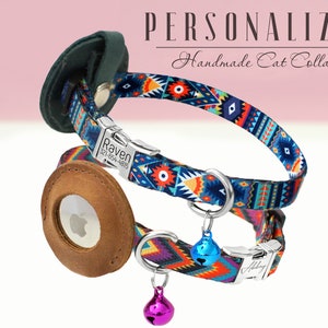 May include: Two colorful cat collars with personalized name tags. The top collar is blue with a geometric pattern and the bottom collar is orange with a geometric pattern. Both collars have a silver bell charm.