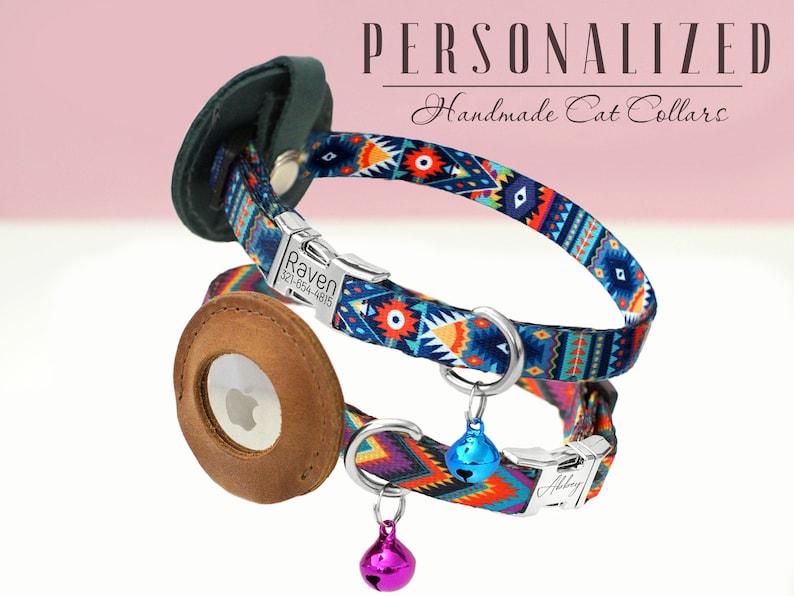 May include: Two colorful cat collars with personalized name tags. The top collar is blue with a geometric pattern and the bottom collar is orange with a geometric pattern. Both collars have a silver bell charm.