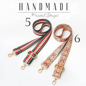 May include: Two handmade printed straps with gold metal hardware. The strap on the left is red, white, and green striped. The strap on the right is beige with a brown floral pattern. The text "HANDMADE Printed Straps" is above the straps. The number "5" is to the left of the straps and the number "6" is to the right of the straps.