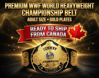 May include: A black leather championship belt featuring large gold plates with an eagle emblem, a globe, and the text WORLD HEAVYWEIGHT WRESTLING CHAMPION. The image includes the text PREMIUM WWF WORLD HEAVYWEIGHT CHAMPIONSHIP BELT ADULT SIZE GOLD PLATES.
