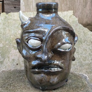 May include: A rustic wooden sign with the text "Welcome to our home" in a handwritten style. The sign has a distressed finish and a simple, inviting design, suitable for a front porch or entryway.