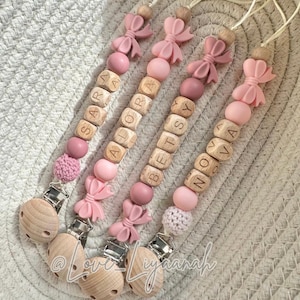 Personalised dummy clip bow: pink crochet bead, pacifier holder
