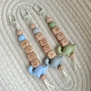 Llavero personalizado con nombre de dinosaurio: etiqueta para mochila escolar con cuentas, ideal para rellenar calcetines navideños. imagen 2