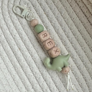 Llavero personalizado con nombre de dinosaurio: etiqueta para mochila escolar con cuentas, ideal para rellenar calcetines navideños. imagen 3