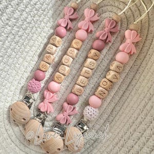 Personalised dummy clip bow: pink crochet bead, pacifier holder