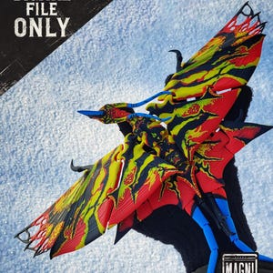 May include: A colorful, detailed model of a winged creature with red, yellow, black, and blue accents. The model has a complex design and is held against a snowy background. The text "DIGITAL FILE ONLY" is visible in the upper left corner, and the "MAGNI! MODELS" logo is in the lower right.