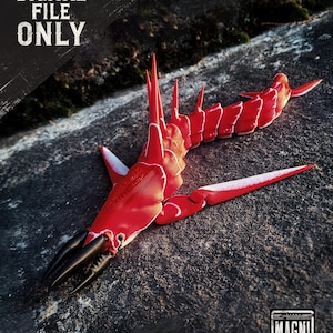 May include: A red and white articulated model of a creature with a segmented body, sharp spikes, and claw-like pincers. The model is lying on a textured gray surface. The text "DIGITAL FILE ONLY" is visible in the upper left corner.