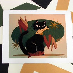 May include: A black cat with a white collar sits in a retro-style illustration. The cat is holding a red fish in its mouth. The background is a green and brown color scheme with a starburst design.