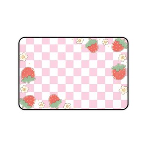 May include: A rectangular mousepad with a pink and white checkered pattern. The design includes cartoon strawberries and small white flowers with yellow centers. The mousepad has a black border.