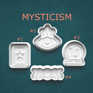 May include: Four white plastic cookie cutters with mystical themes. The shapes include a star in a rectangle, an eye, a crystal ball with stars, and a triple moon phase design. The word "MYSTICISM" is printed in orange.