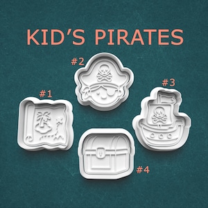 May include: Four white plastic cookie cutters labeled KID'S PIRATES. Number 1 is a treasure map, number 2 is a pirate face with an eye patch and hat, number 3 is a pirate ship with a skull and crossbones, and number 4 is a treasure chest.