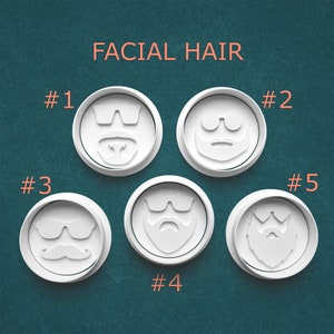 May include: Five white, circular molds with different facial hair designs, including mustaches, beards, and sunglasses. The text "FACIAL HAIR" is displayed above the molds, with numbers next to each design.