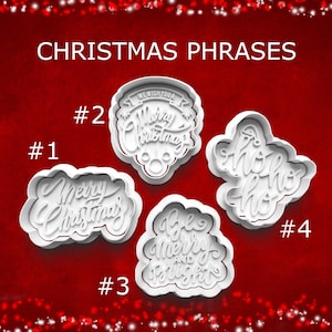 May include: White plastic Christmas phrase cookie cutters. The phrases include "Merry Christmas", "We Wish You a Merry Christmas", "Be Merry and Bright", and "Ho Ho Ho". The text "CHRISTMAS PHRASES" is at the top.