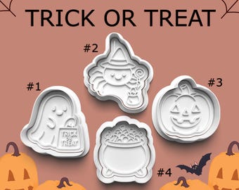 May include: White Halloween-themed cookie cutters in the shapes of a ghost holding a trick-or-treat bag, a witch spider, a jack-o'-lantern, and a cauldron. The words "TRICK OR TREAT" are at the top of the image. Pumpkins and a bat are also visible.