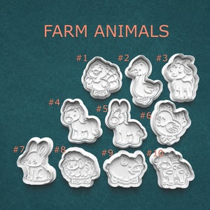 May include: A collection of ten white plastic cookie cutters in the shapes of farm animals, including a turkey, duck, goat, horse, donkey, chicken, rabbit, sheep, pig, and cow. The words "FARM ANIMALS" are displayed above the cutters.