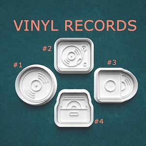 May include: Four white plastic cookie cutters labeled VINYL RECORDS. Item #1 is circular with a record design. Item #2 is square with a turntable. Item #3 is a rounded square with a record sleeve. Item #4 is a crate filled with vinyl records.