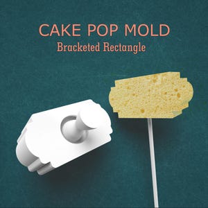 May include: White cake pop mold with a plunger and a bracketed rectangle shape. A yellow sponge cake pop on a white stick is also shown. Text on the image reads "CAKE POP MOLD Bracketed Rectangle".
