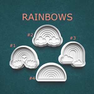 May include: A set of three ceramic mugs with a speckled, matte finish. The mugs are in shades of cream, light brown, and dark brown. Each mug has a simple, minimalist design and a rounded handle.