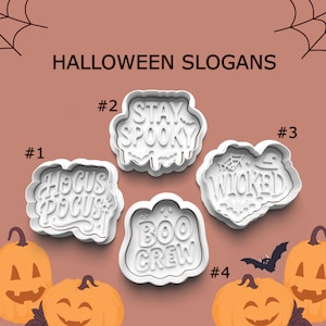 May include: White Halloween-themed cookie cutters with the phrases "Hocus Pocus", "Stay Spooky", "Wicked", and "Boo Crew". The image also includes orange pumpkins and the text "Halloween Slogans".