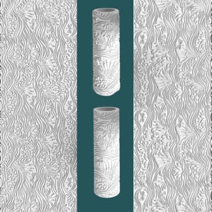 May include: Two white cylindrical vases with embossed floral and dragonfly designs are displayed against a teal background. The vases are flanked by panels with a matching embossed floral pattern. The overall design is intricate and detailed.