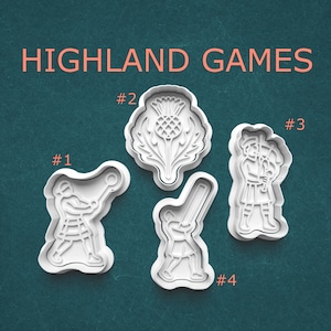 May include: Four white plastic cookie cutters with Highland Games themes. The cutters include a thistle, a person throwing a ball, a person playing bagpipes, and a person swinging a bat. The words "HIGHLAND GAMES" are in orange text.
