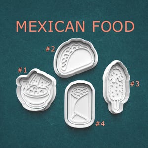 May include: White plastic cookie cutters in the shapes of Mexican food items, including nachos, a taco, corn on the cob, and a burrito. The words "MEXICAN FOOD" are printed in orange above the cutters on a teal background.