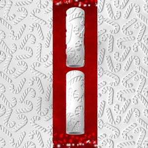 May include: White cylindrical object with a candy cane pattern, set against a red background with white accents. The design features embossed candy canes. The image is festive and suitable for holiday-themed products.