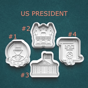 May include: A handmade wooden sign with the text "Welcome" in a playful font. The sign is painted white with a distressed finish, and features a decorative floral design in shades of pink and green. It is designed for indoor or outdoor use.