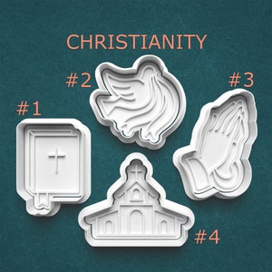 May include: Set of four white plastic cookie cutters with Christian themes. The cutters are numbered 1 through 4. Cutter #1 is a closed book with a cross on the cover. Cutter #2 is a dove with its wings spread. Cutter #3 is a pair of hands clasped in prayer. Cutter #4 is a church building with a cross on the steeple.