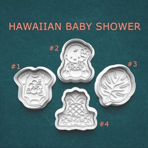 May include: Four white plastic cookie cutters labeled HAWAIIAN BABY SHOWER. Cutter #1 is a baby onesie with a hibiscus flower. #2 is a baby with a flower. #3 is a monstera leaf. #4 is a pineapple with flowers. Each cutter has a detailed embossed design.