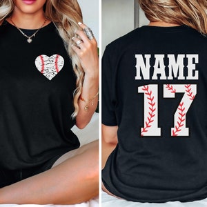 May include: Black t-shirt with a baseball heart design on the front and the text "NAME 17" on the back.