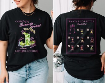 May include: Black t-shirt with a pink graphic of a mojito cocktail recipe and the text "Courtney's Bachelorette Weekend The Mojito Favourite Cocktail". The back of the shirt has a pink graphic of a bucket list with checkboxes and different cocktails.