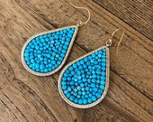 Turquoise ans gold wire wrapped large tear drop earrings.