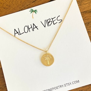 Gold palm tree charm necklace on fine 14k gold filled chain.