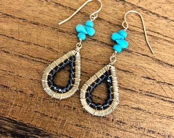 Wire wrapped Sleeping Beauty turquoise and Swarovski earrings.