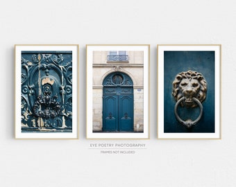 May include: A set of three framed prints featuring close-up details of a teal blue door with ornate metalwork. The first print shows a close-up of the door's intricate design, the second print shows the entire door, and the third print shows a lion's head door knocker.