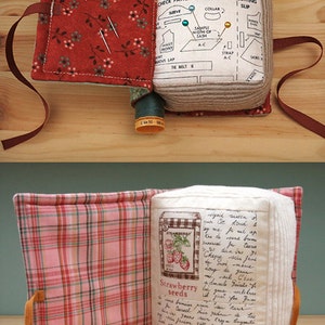 May include: Two fabric-covered books with a plaid and floral pattern. The books are open and have a handwritten message inside. The books are filled with sewing supplies, including needles, thread, and pins.