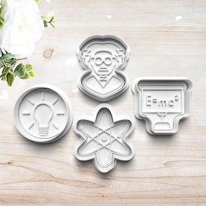 May include: Four white plastic cookie cutters in science-themed shapes. Includes a lightbulb, an atom, a professor, and a chalkboard with the equation E=mc². Perfect for baking cookies for a science-themed party.