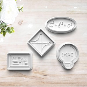 May include: Four white plastic cookie cutters in various shapes. One is a rectangle with math symbols, another is a diamond with a graph, an oval with a formula, and a lightbulb shape with the equation 1+1=2.