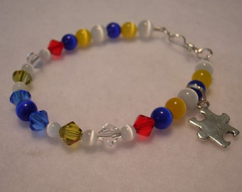 Autism Awareness Swarovski Crystal and Cats Eye Puzzle Piece Bracelet