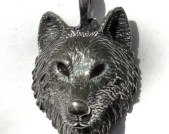 Timber Wolf Pendant With Brown Eyes In Sterling Silver